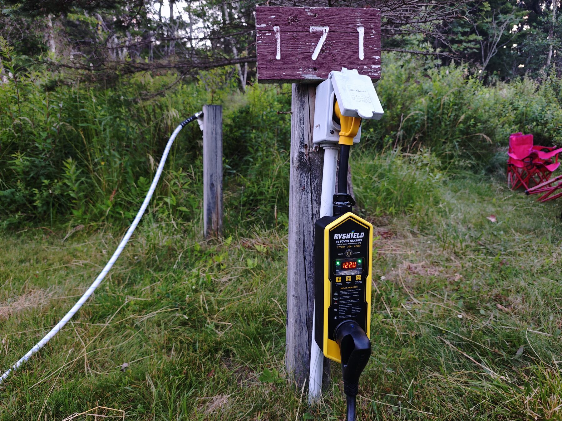 RVShield powered on at a rustic campground pedestal marked 171